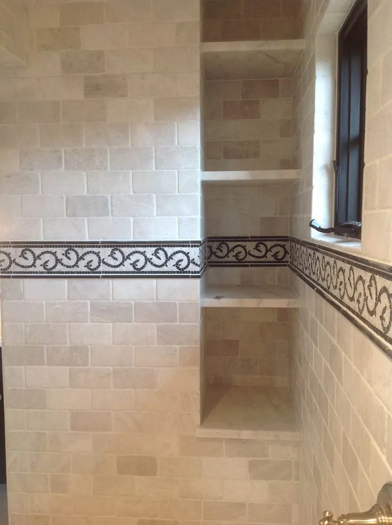 A bathroom with tiled walls and floors