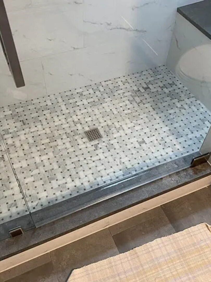 A shower floor that has been cleaned and is ready for use.